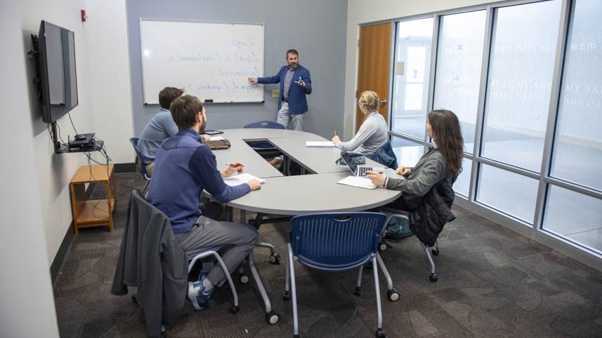 Andrew Harris teaching communication students.